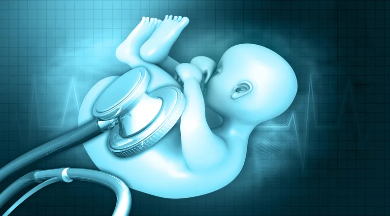 胎児と聴診器のイラスト